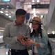 Couple Asian people walking in airport terminal waiting for  flight boarding. - VideoHive Item for Sale