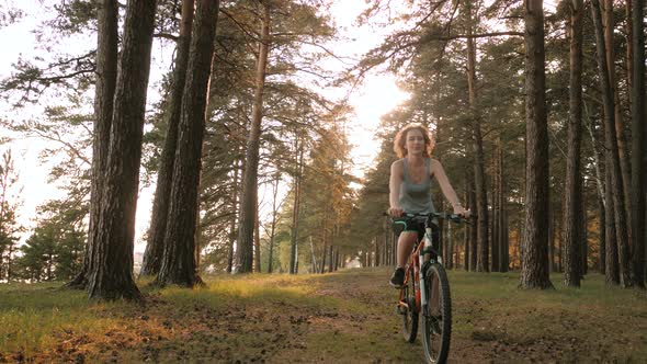 Active Young Woman Riding Bike Outdoor