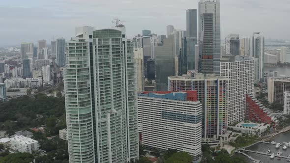 Aerial view of a few buildings in downtown Miamiing towards the buildings