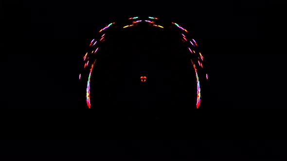 animated round shape of multicolor flashing lights, on a black background