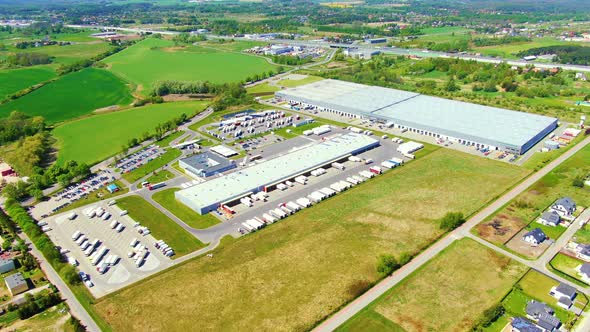 Aerial view of warehouse storages or industrial factory or logistics center from above. Top view of