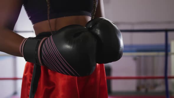 Mixed race woman with boxing gloves