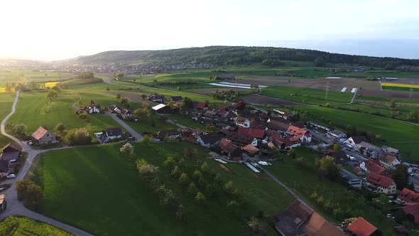 Aerial video of a traditional Swiss Village in the Aarau County of Switzerland during spring