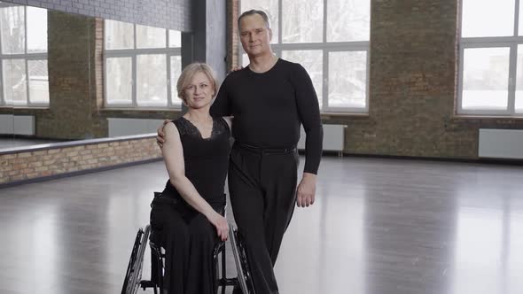 Professional Ballroom Dancers Posing in Dance Hall