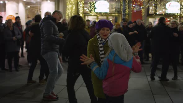 People dancing on the street alt