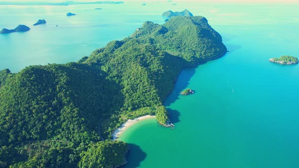 An aerial view of the coast, mountains with many beautiful islands