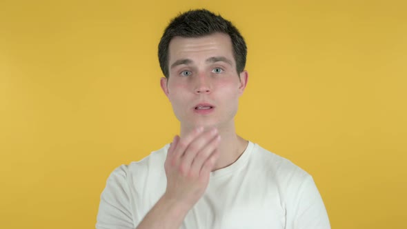 Flying Kiss By Man, Yellow Background