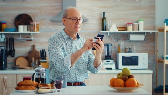 Senior Man Doing Online Transaction