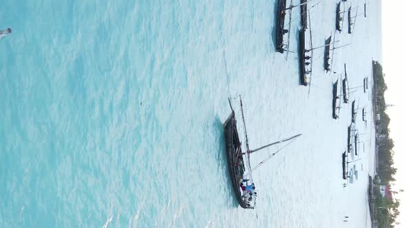 Tanzania Vertical Video  Boat Boats in the Ocean Near the Coast of Zanzibar Aerial View