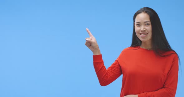 Young Woman Pointing with Finger