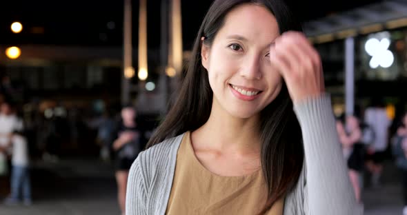 Young woman smile to camera at night 