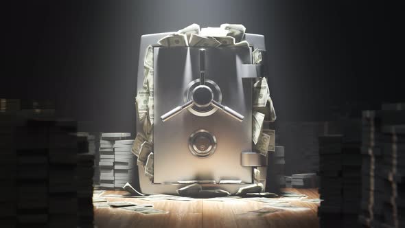 Armored steel safe stuffed with money. Closed safe with stacks of money.