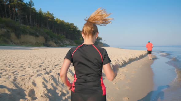 Woman Runs on Sea Beach