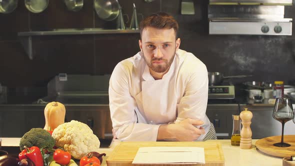 Chef Looking Straight to the Camera in Kitchen