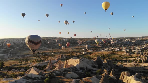 Aerial Hot Air Balloons Flying Over Hoodoos and Fairy Chimneys in Goreme Valley Cappadocia, Turkey