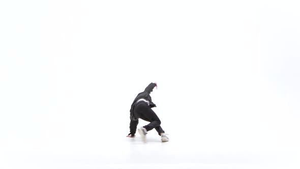 Little Boy Is Dancing a Modern Dance on the White Background in Black Leather Jackets and Jeans