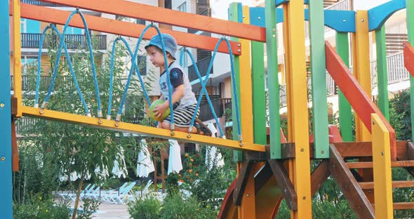 Kid Boy Having Fun to Play on Children Playground