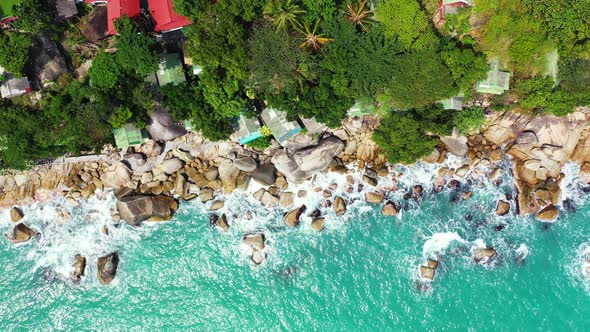 Wide above tourism shot of a white sand paradise beach and blue sea background 