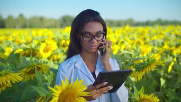 Female Agronomist Using Modern Technology in Field