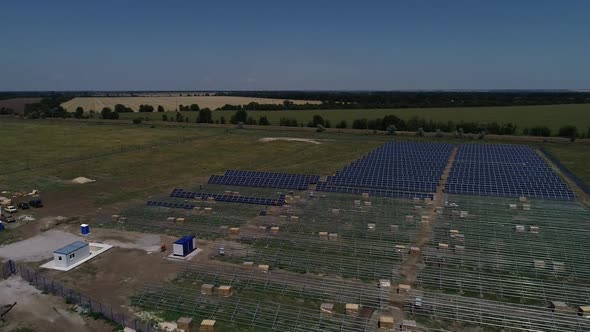 Solar Panel Mounting Racks in Many Rows at a Construction of a Power Station