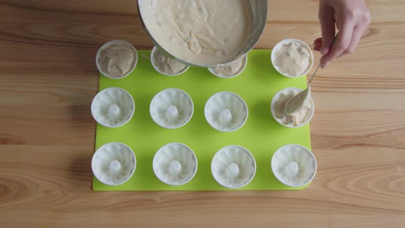 Woman Is Cooking Vanilla Muffins