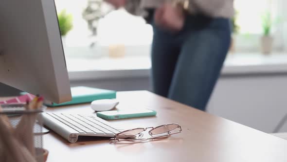 Young Woman Dances in her Home Office