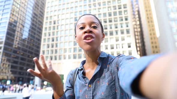 Black woman having a selfie video call with phone