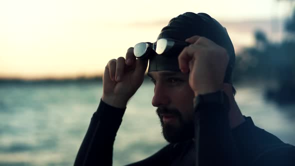 Professional Triathlete Prepare Sport Swimming Workout On Sea. Professional Swimmer Wearing Cup.