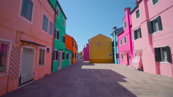 Street with Old Multicolored Houses Under Cloudless Sky