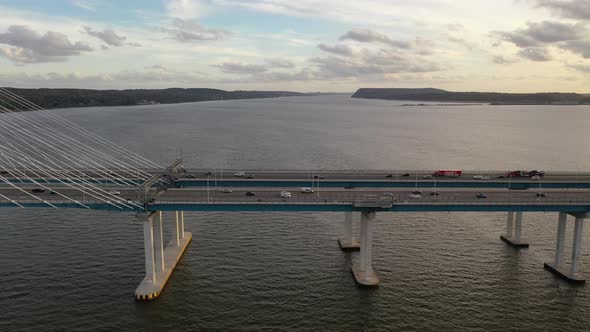 An aerial shot of the side of the Mario M. Cuomo Bridge, taken on the north side. The camera truck l