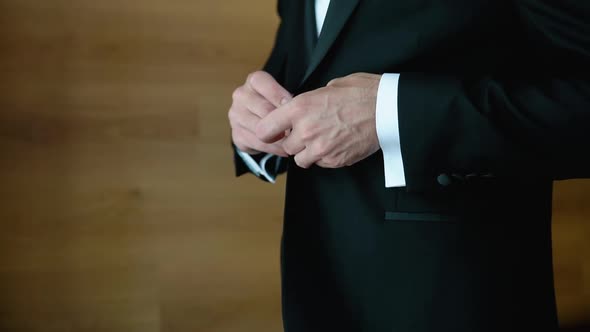 A Successful Young Man Puts on a Suit Black Jacket