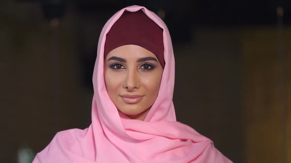 Close-up Portrait of a Muslim Woman in National Clothes. Slow Motion