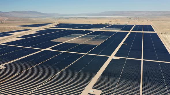 Cinematic  Aerial View From Drone of Big Solar Power Fields in Vast Landscape alt