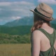 Woman With Hat In Sunny Mountain Filed - VideoHive Item for Sale