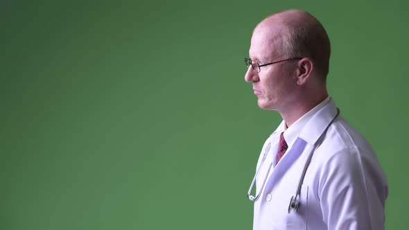 Profile View of Mature Bald Man Doctor