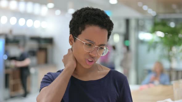 Portrait of Casual African Woman Having Neck Pain 