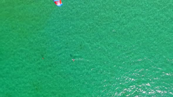 A man kiteboarding on a hydrofoil kite board