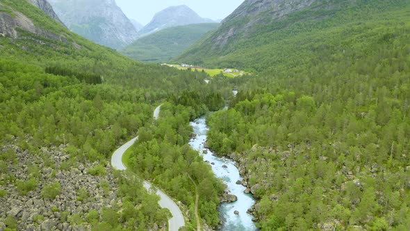 Aerial View Of Rocky Stream Flowing Along Mountain Pass And Forest In Andalsnes, Norway.