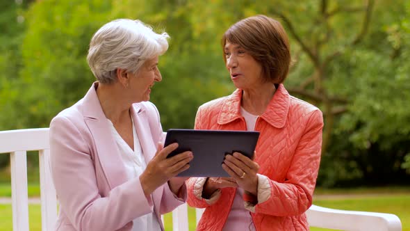 Senior Women with Tablet Pc at Summer Park