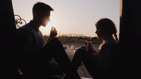 Teenager with a Younger Sister Will Have a Snack at a Gas Station, Rest in a Car Trip