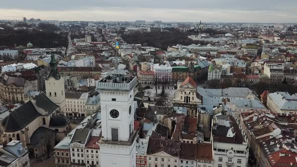 Lviv Ukraine  March 3 2020 View on Lviv City Hall with Ukrainian Flag From Drone