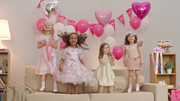 Kids Jumping on Sofa at Birthday Party