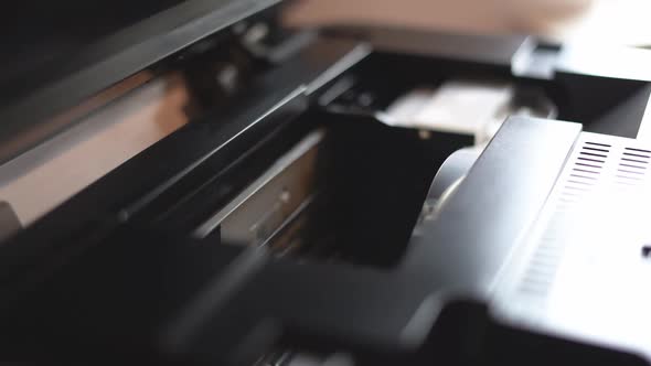 Printer in the Process of Printing with an Open Housing