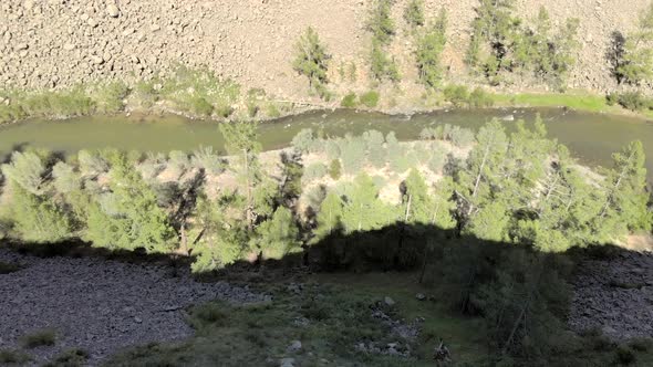 Broken Crumbled Rocks Spilling From the Narrow Canyon Slope Ridge Towards the Deep Valley Floor