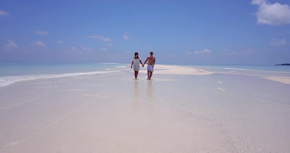 Beautiful man and woman after marriage in love live the dream on beach on clean white sand backgroun