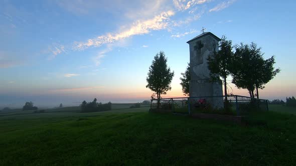 Aerial shot around a catholic shrine during sunrise , Poland.