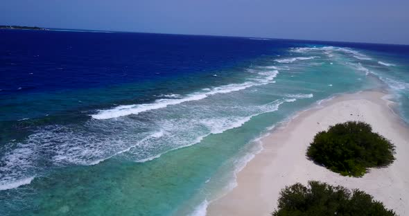 Daytime drone abstract shot of a white paradise beach and aqua blue ocean background in high resolut