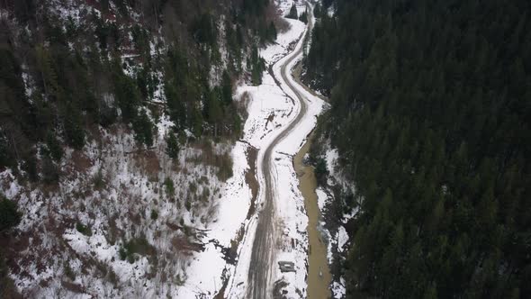 Winter forest and mountains from air. Winter landscape. aerial drone shot. river