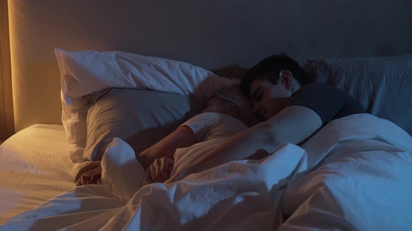 Sleeping Couple Man Embrace Cuddle Wife Bed Night