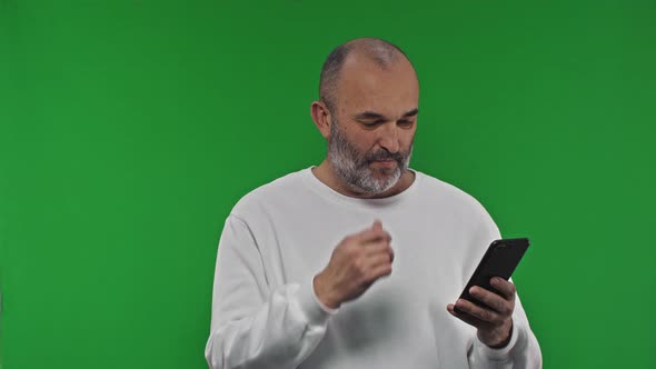 Mature Mid Aged Man Using a Phone